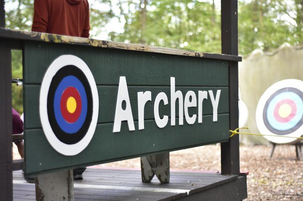 What are the specific muscle groups that archers should train to prevent shoulder injuries?